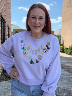 Queen of Sparkles Licensed Lavender Wicked Charm Necklace Sweatshirt